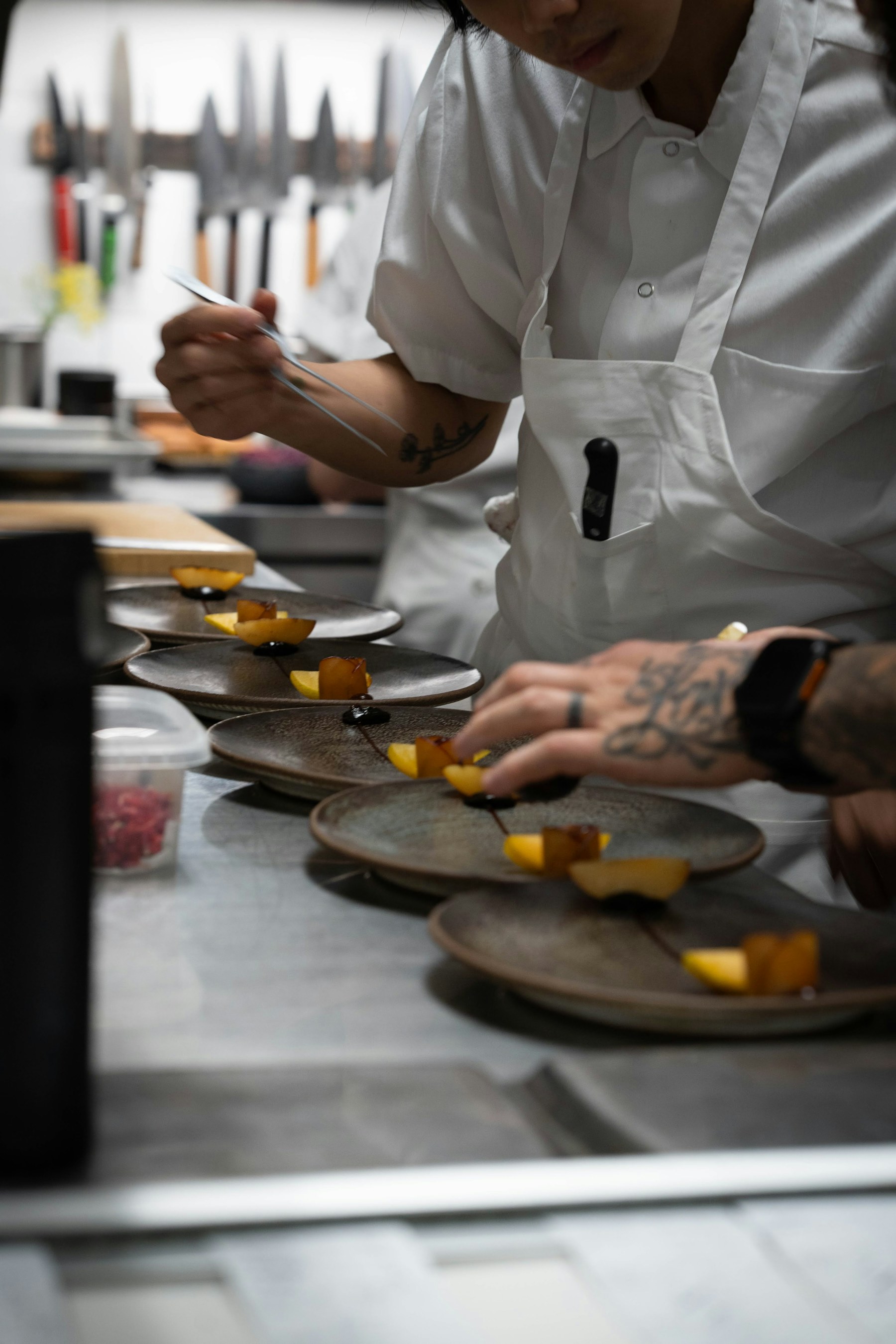 Professional kitchen team preparing dishes
